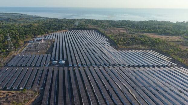 Aerial view of PLTS Bali Timur solar power plant in Indonesia. Aerial view of PLTS Bali Timur solar power plant in Indonesia.