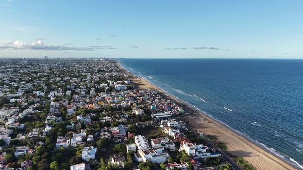 Aerial view of Chennai coastline and urban beach India.
