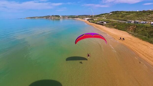 Aerial view of a paramotor flying over Kilyos beach Turkey. Aerial view of a paramotor flying over Kilyos beach Turkey.