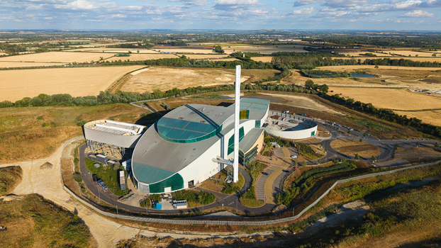 Aerial view of the Energy Recovery Facility a biomass to electricity plant surrounded by rural fields and infrastructure in Bicester England United Kingdom.
