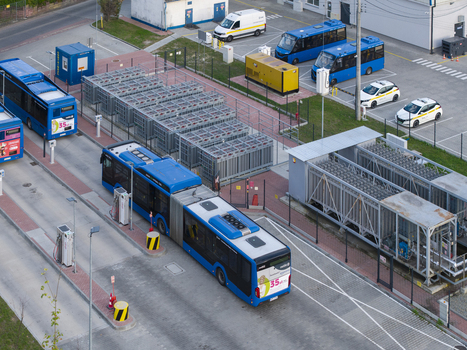 Krakow Poland 16 September 2026 Aerial view of blue buses parked at a CNG station with industrial equipment and paved ground.