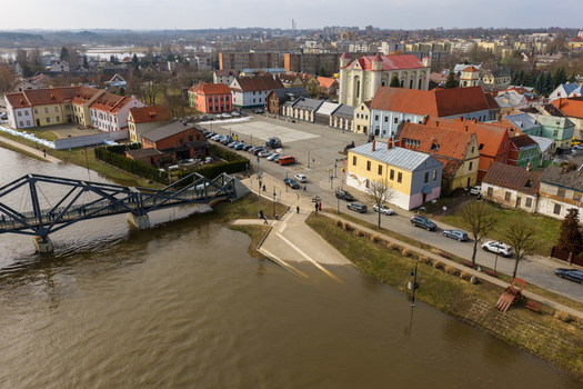 Kedainiai Lithuania 17 March 2026 Aerial view of the historic old town with the Nevezis river a metal bridge and the Great Market Square surrounded by colorful buildings. Kedainiai Lithuania 17 March 2026 Aerial view of the historic old town with the Nevezis river a metal bridge and the Great Market Square surrounded by colorful buildings.