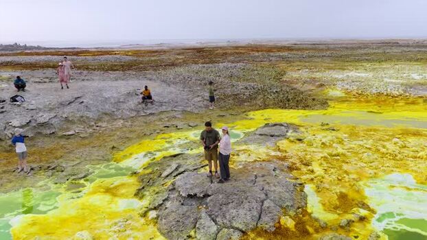 Aerial view of people exploring the colorful Danakil Desert Ethiopia. Aerial view of people exploring the colorful Danakil Desert Ethiopia.
