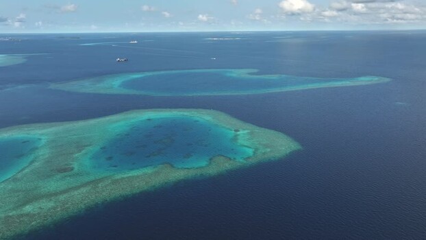 Aerial view of coral reefs and turquoise lagoons Maldives. Aerial view of coral reefs and turquoise lagoons Maldives.