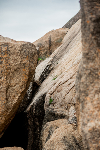 View of large weathered granite rock formations with small patches of green vegetation in the crevices in Jos North Plateau Nigeria. View of large weathered granite rock formations with small patches of green vegetation in the crevices in Jos North Plateau Nigeria.
