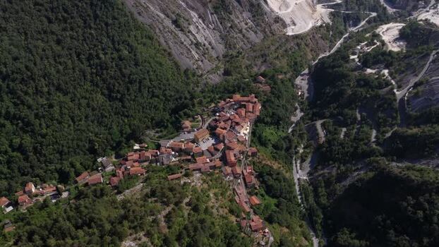 Aerial view of Colonnata village nestled in the mountains of Italy. Aerial view of Colonnata village nestled in the mountains of Italy.