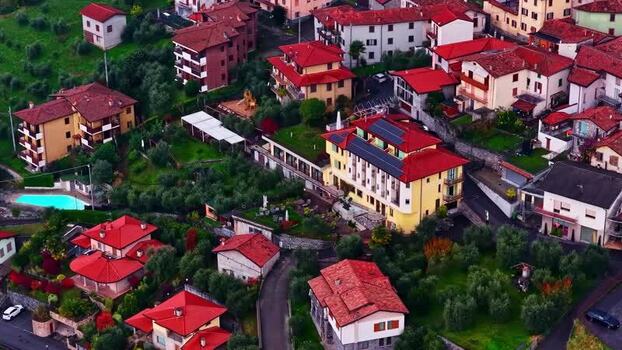 Aerial view of a small village with red roofed houses in Italy.