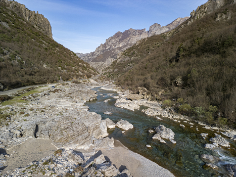 Aerial view of the Kir River flowing through a rocky mountain canyon with clear water and steep slopes in Shkoder Qarku i Shkodres Albania. Aerial view of the Kir River flowing through a rocky mountain canyon with clear water and steep slopes in Shkoder Qarku i Shkodres Albania.