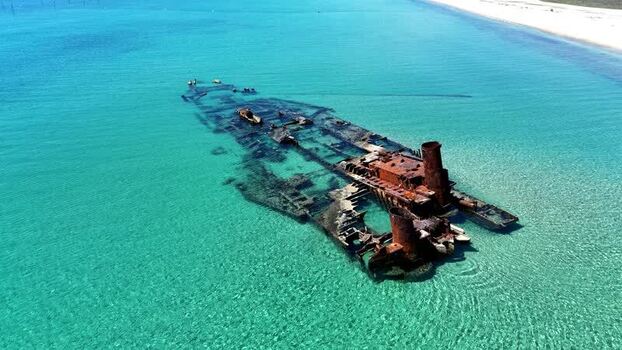Aerial view of Shipwreck Epanomi in turquoise waters Greece.