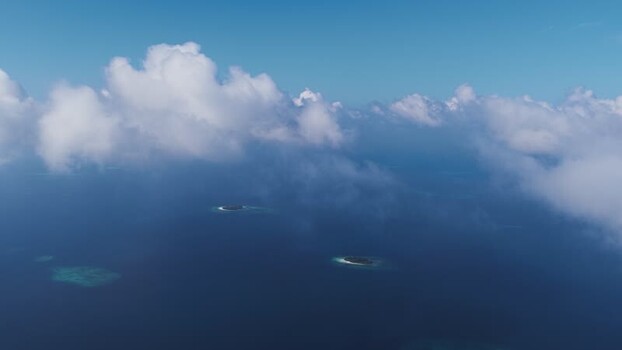 Aerial view of tropical islands and clouds in Kudahuvadhoo Maldives. Aerial view of tropical islands and clouds in Kudahuvadhoo Maldives.