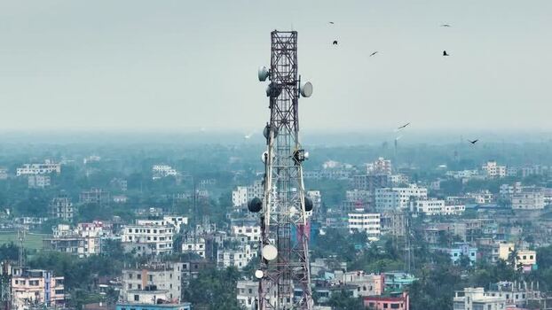 Aerial view of a telecommunication tower over a city Bangladesh. Aerial view of a telecommunication tower over a city Bangladesh.