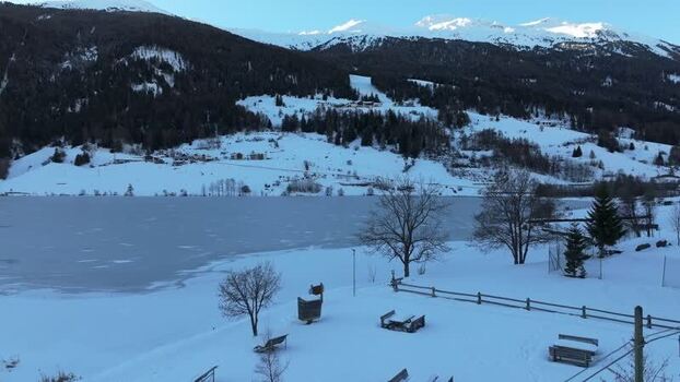 Aerial view of frozen Reschensee lake in Graun im Vinschgau Italy. Aerial view of frozen Reschensee lake in Graun im Vinschgau Italy.