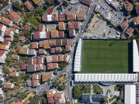 Aerial view of a football stadium nestled among dense urban residential buildings and streets in Istanbul Istanbul Turkiye. Aerial view of a football stadium nestled among dense urban residential buildings and streets in Istanbul Istanbul Turkiye.