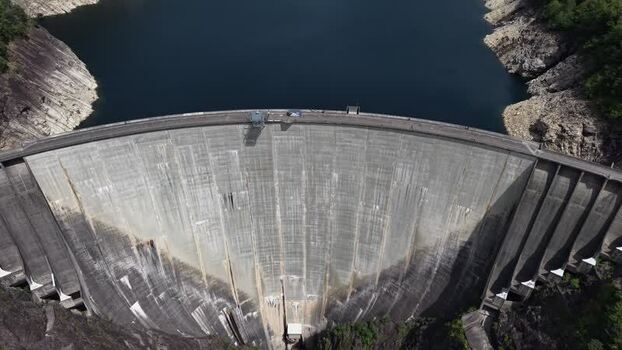 Aerial view of the massive Verzasca Dam and reservoir Switzerland.