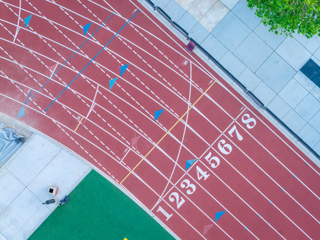 Aerial view of the running track at Sports Town USA with numbered lanes and white markings in Las Vegas Nevada United States. Aerial view of the running track at Sports Town USA with numbered lanes and white markings in Las Vegas Nevada United States.