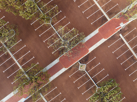 Aerial view of the parking lot at Percy Doyle Reserve with marked parking spaces and surrounding trees in Duncraig Western Australia Australia. Aerial view of the parking lot at Percy Doyle Reserve with marked parking spaces and surrounding trees in Duncraig Western Australia Australia.