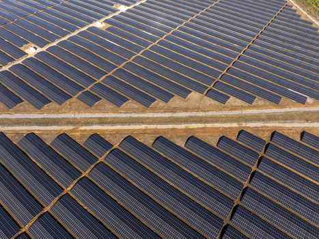 Aerial view of a large solar farm with rows of photovoltaic panels arranged in neat lines across the landscape in Lovech Lovech Bulgaria. Aerial view of a large solar farm with rows of photovoltaic panels arranged in neat lines across the landscape in Lovech Lovech Bulgaria.