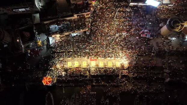 Aerial view of Dashashwamedh Ghat with a large crowd at night India. Aerial view of Dashashwamedh Ghat with a large crowd at night India.