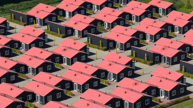 Drone view of AZC Luttelgeest in the Netherlands showing a reception centre for asylum seekers temporary housing community facilities and social infrastructure. Drone view of AZC Luttelgeest in the Netherlands showing a reception centre for asylum seekers temporary housing community facilities and social infrastructure.