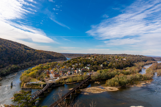 Harpers Ferry United States 16 November 2019 Aerial view of historic Harpers Ferry at the confluence of the Potomac and Shenandoah rivers with railway bridges and trees. Harpers Ferry United States 16 November 2019 Aerial view of historic Harpers Ferry at the confluence of the Potomac and Shenandoah rivers with railway bridges and trees.