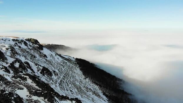 Aerial view of Balkan Mountains above clouds in Bulgaria.