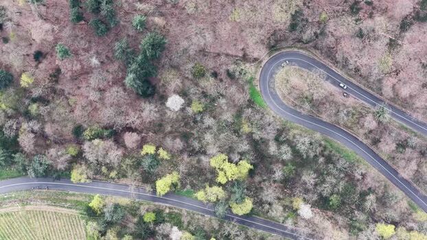 Aerial view of winding road with cars France.