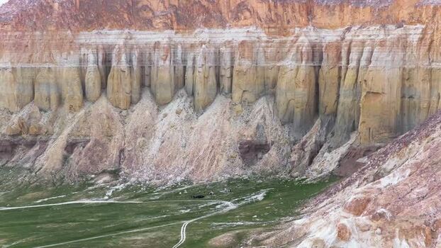Aerial view of Airakty mountains with layered cliffs and green valley Kazakhstan. Aerial view of Airakty mountains with layered cliffs and green valley Kazakhstan.