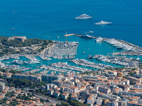 Aerial view of Port Vauban marina filled with luxury yachts and the historic Fort Carre overlooking the Mediterranean Sea in Antibes Provence Alpes Cote d Azur France. Aerial view of Port Vauban marina filled with luxury yachts and the historic Fort Carre overlooking the Mediterranean Sea in Antibes Provence Alpes Cote d Azur France.