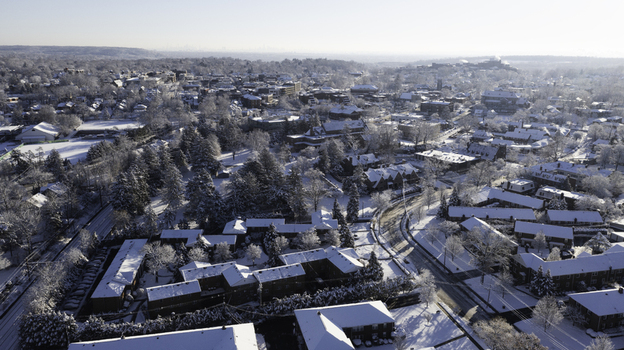 Aerial view of the snow covered town of Summit with residential buildings tree lined streets and winter landscape in Summit New Jersey United States. Aerial view of the snow covered town of Summit with residential buildings tree lined streets and winter landscape in Summit New Jersey United States.