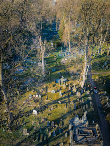 Aerial view of Bernardine Cemetery with historic gravestones tall trees and a walking path in Vilnius Vilniaus apskritis Lithuania. Aerial view of Bernardine Cemetery with historic gravestones tall trees and a walking path in Vilnius Vilniaus apskritis Lithuania.