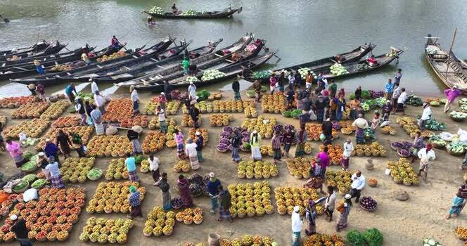 Aerial view of a riverside vegetable market Bangladesh.