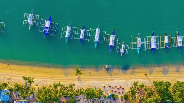 Aerial view of outrigger boats on a tropical beach Philippines.