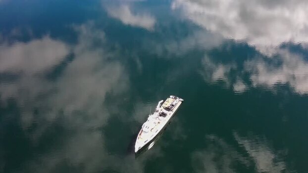 Aerial view of a yacht on calm water in Hvalfjordur Iceland. Aerial view of a yacht on calm water in Hvalfjordur Iceland.