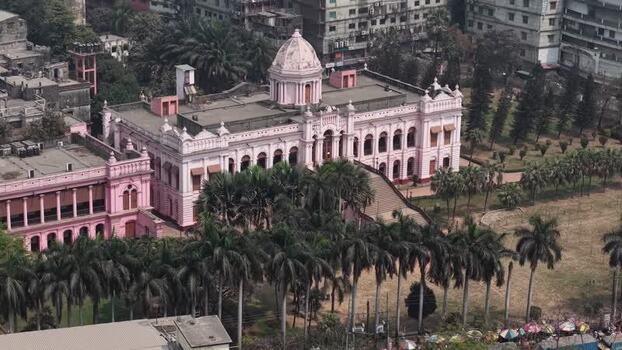Aerial view of Ahsan Manzil palace and surrounding palm trees Bangladesh.