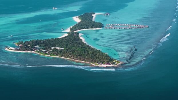 Aerial view of a tropical island resort Maldives. Aerial view of a tropical island resort Maldives.