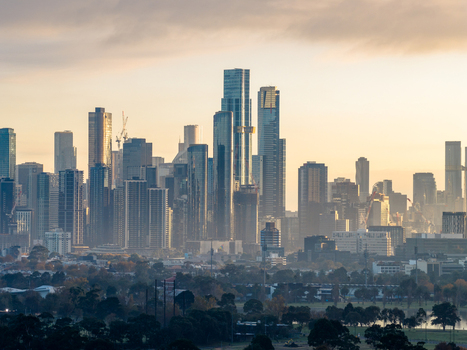 Aerial view of the Melbourne skyline featuring modern skyscrapers and urban architecture bathed in golden hour light in Melbourne Victoria Australia. Aerial view of the Melbourne skyline featuring modern skyscrapers and urban architecture bathed in golden hour light in Melbourne Victoria Australia.
