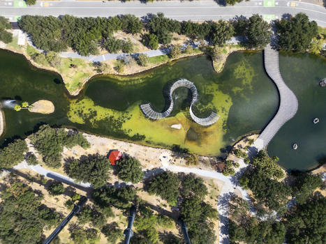 Aerial view of the serpentine sculpture in the lake at Fundidora Park and Paseo de la Mujer in Monterrey Nuevo Leon Mexico. Aerial view of the serpentine sculpture in the lake at Fundidora Park and Paseo de la Mujer in Monterrey Nuevo Leon Mexico.
