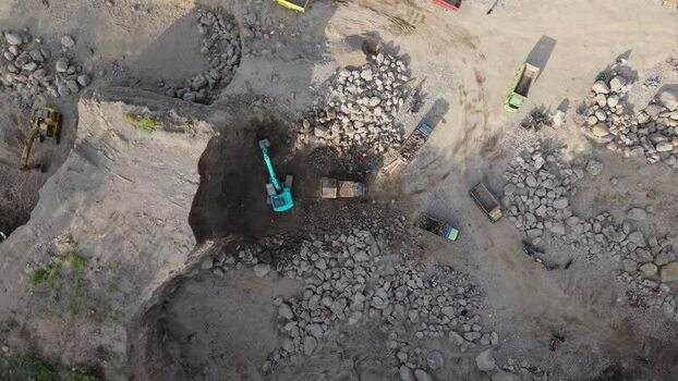 Aerial view of trucks and excavator Indonesia. Aerial view of trucks and excavator Indonesia.