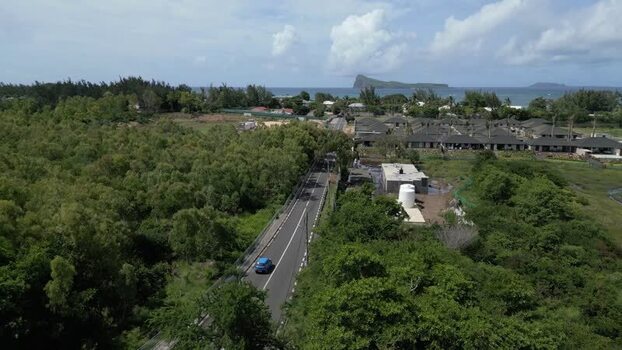 Aerial view of Cap Malheureux coastal road in Mauritius.
