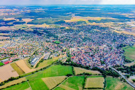 Aerial view of the historic town of Hochstadt featuring traditional red roofed houses and green agricultural fields Hochstadt Bavaria Germany.