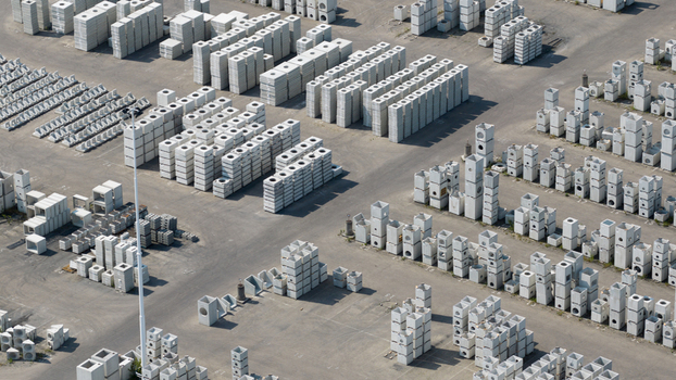 Aerial view of stacks of precast concrete blocks and industrial components organized in an outdoor storage yard in Oosterhout North Brabant Netherlands. Aerial view of stacks of precast concrete blocks and industrial components organized in an outdoor storage yard in Oosterhout North Brabant Netherlands.