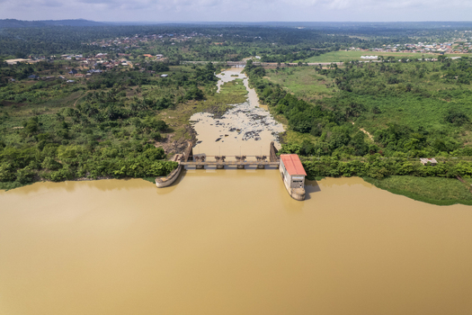 Aerial view of the Asejire dam with its reddish brown building amidst the lush green vegetation Asejire Oyo Nigeria. Aerial view of the Asejire dam with its reddish brown building amidst the lush green vegetation Asejire Oyo Nigeria.