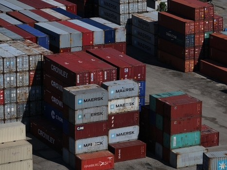 Cincinnati United States 19 April 2026 Aerial view of stacks of colorful shipping containers from various logistics companies in a busy industrial port terminal.