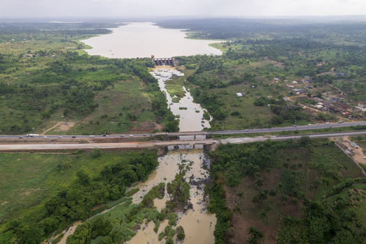 Aerial view of the Asejire Dam its concrete structure stark against the muddy water and vibrant green vegetation Asejire Oyo Nigeria. Aerial view of the Asejire Dam its concrete structure stark against the muddy water and vibrant green vegetation Asejire Oyo Nigeria.