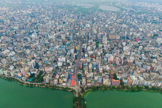 Dhaka Bangladesh 19 June 2026 Aerial view of Gulshan Lake surrounded by dense urban sprawl high rise buildings and intricate road networks in the capital city.