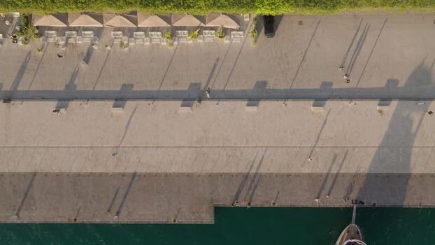 Aerial view of people walking on Ortigia promenade Italy.