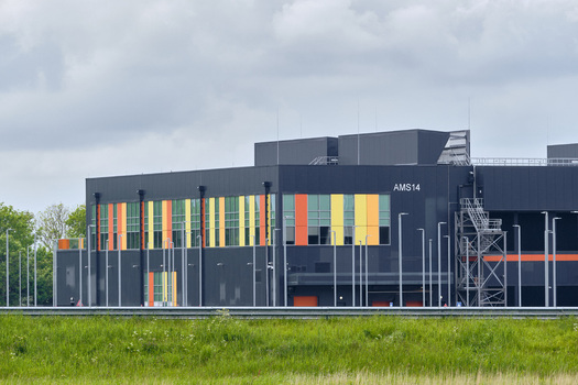 Middenmeer Netherlands 17 May 2026 View of the Microsoft data center facility with colorful facade panels and industrial architecture under a cloudy sky.
