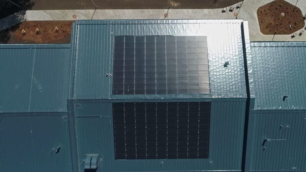 Aerial view of solar panels on a rooftop in Latvia.