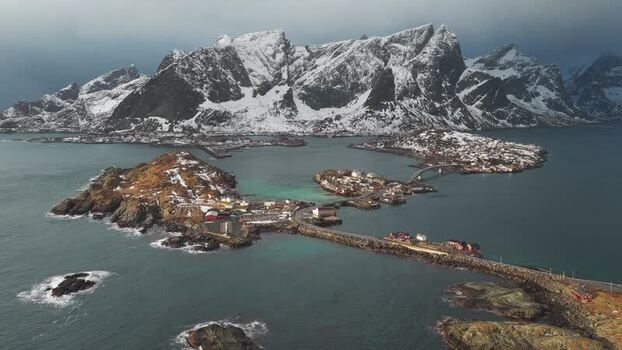 Aerial view of Hamn&oslash;y and snow capped mountains Norway.