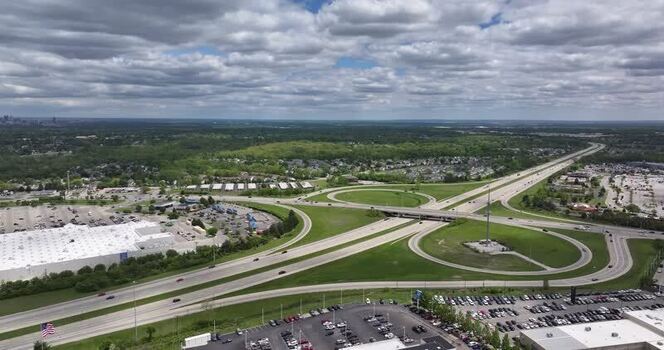 Aerial view of a highway interchange and parking lots United States. Aerial view of a highway interchange and parking lots United States.